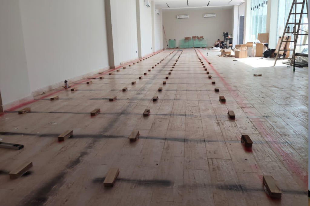 Interior view of flooring installation in progress at Tarseem project.